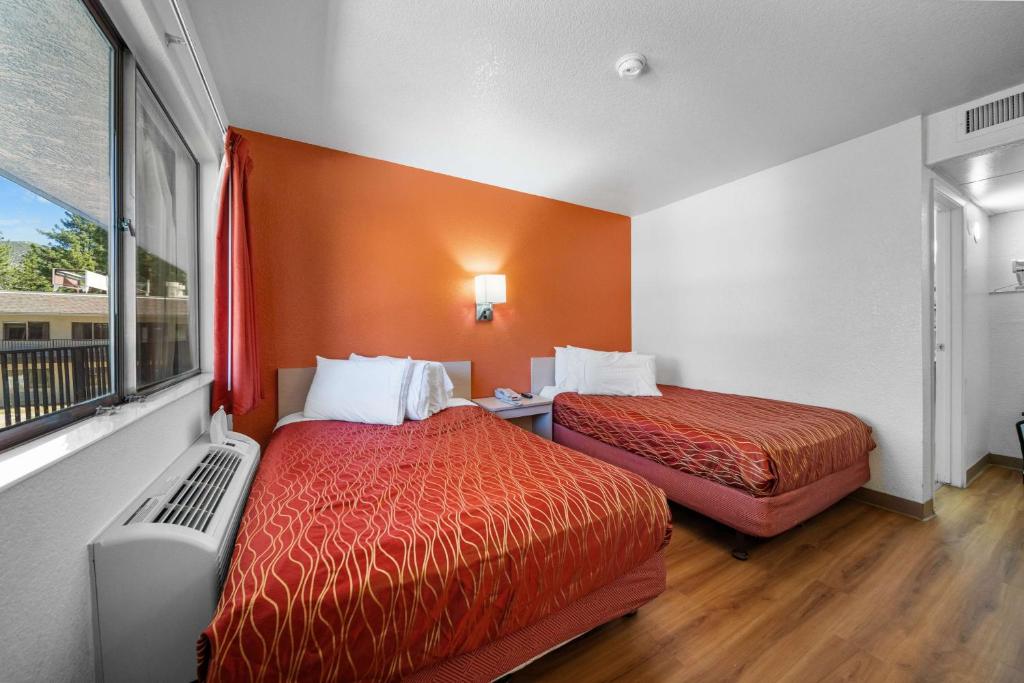 a hotel room with two beds and a window at Motel 6-Big Bear Lake, CA in Big Bear Lake