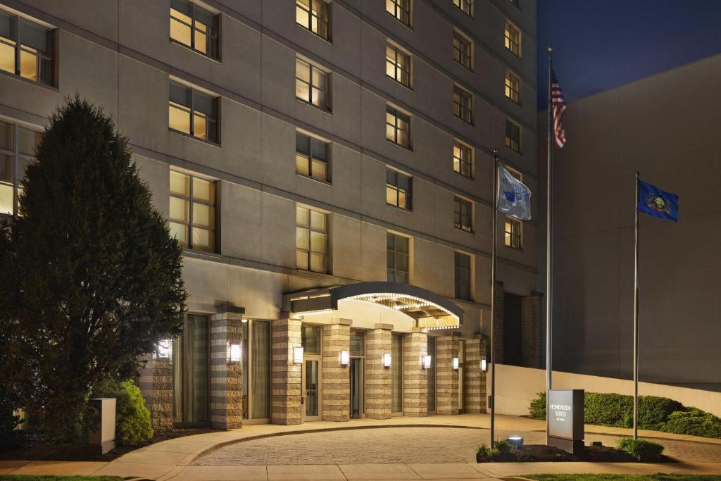 a building with two flags in front of it at Homewood Suites by Hilton Philadelphia-City Avenue in Philadelphia