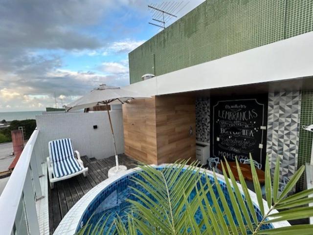 Uma varanda ou terraço em Linda cobertura vista mar