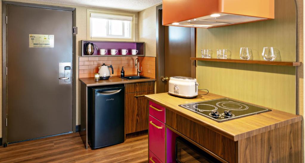 Kuchyň nebo kuchyňský kout v ubytování Hotel Zed Victoria