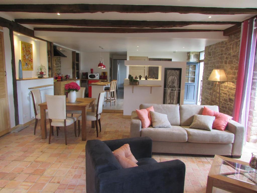 a living room with a couch and a table at Hauts De La Brancherie in Léhon