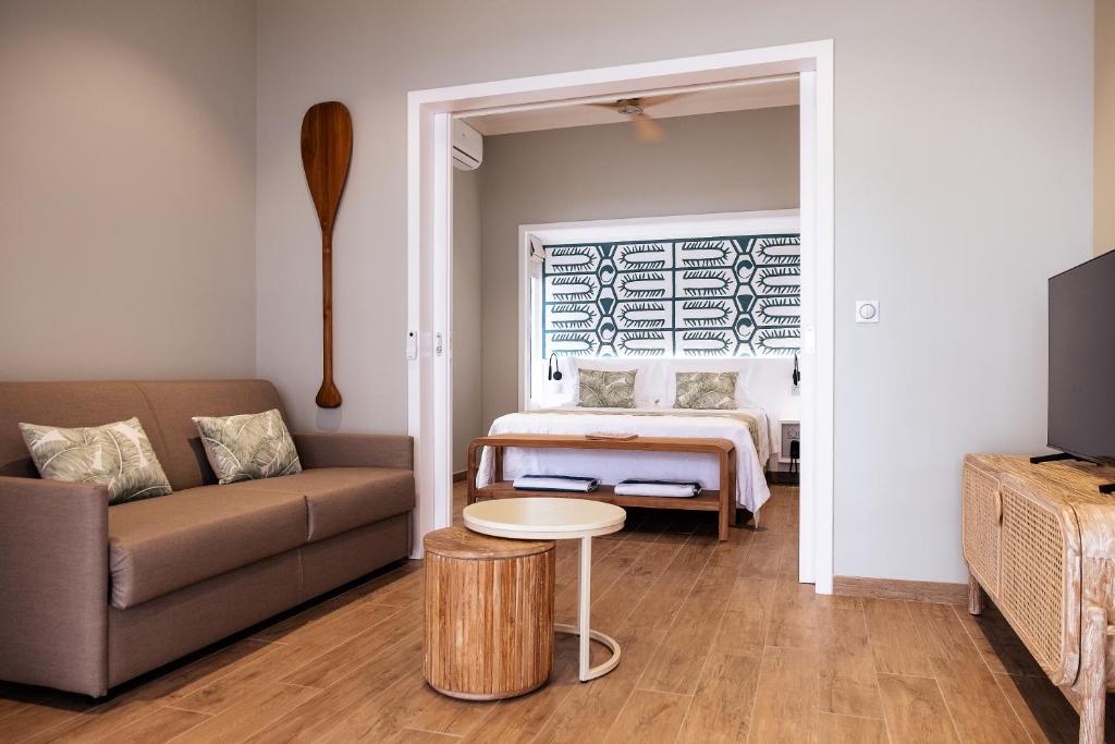 Postel nebo postele na pokoji v ubytování Niu Beach Hôtel Moorea