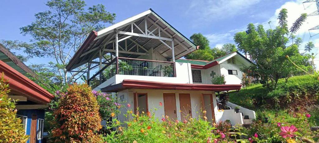 a house with a balcony on top of it at Davao City-Marilog Peak Cafe- Traveler's Staycation in Davao City