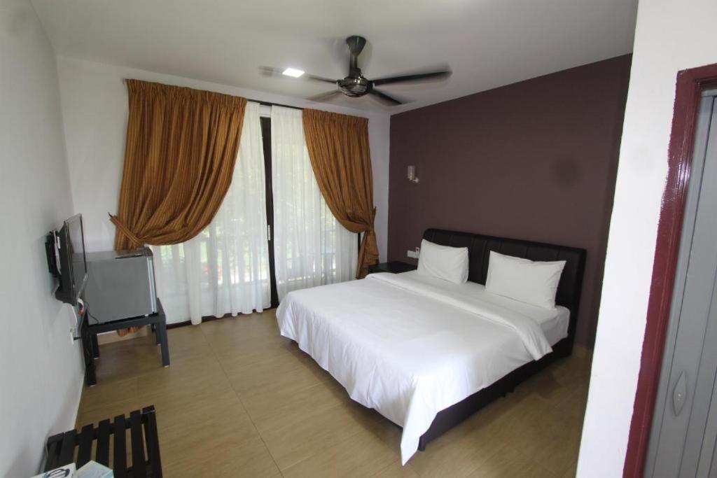 Ein Bett oder Betten in einem Zimmer der Unterkunft Red Coral Cottage