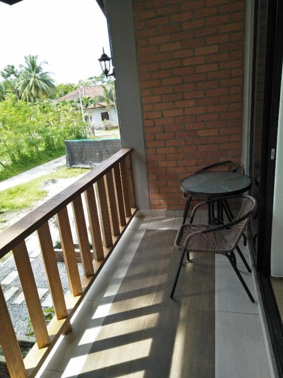 Ein Balkon oder eine Terrasse in der Unterkunft Red Coral Cottage
