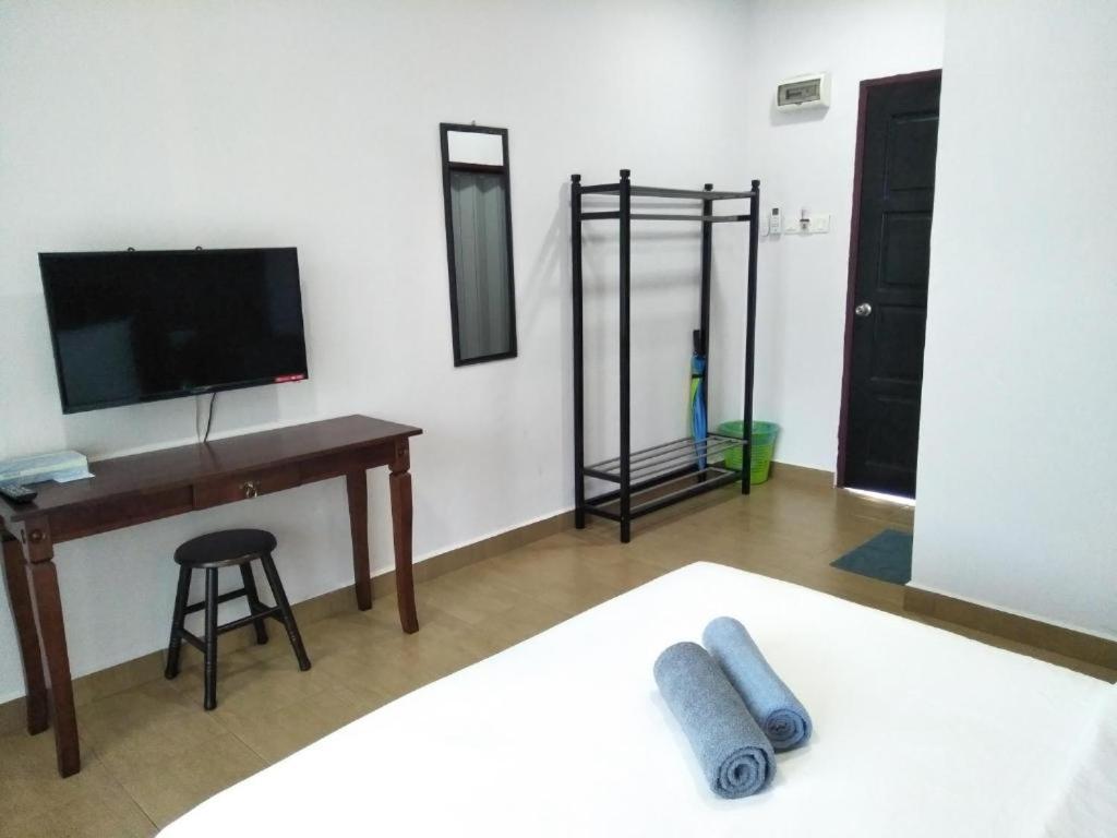 Ein Bett oder Betten in einem Zimmer der Unterkunft Red Coral Cottage