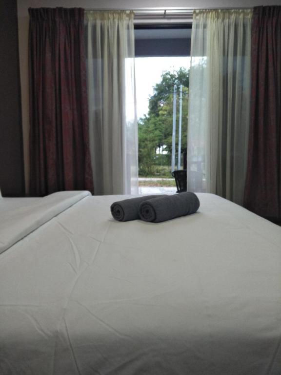 Ein Bett oder Betten in einem Zimmer der Unterkunft Red Coral Cottage