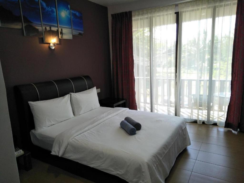 Ein Bett oder Betten in einem Zimmer der Unterkunft Red Coral Cottage