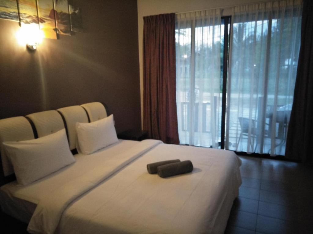 Ein Bett oder Betten in einem Zimmer der Unterkunft Red Coral Cottage