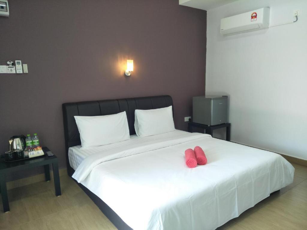 Ein Bett oder Betten in einem Zimmer der Unterkunft Red Coral Cottage