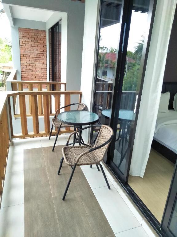 Ein Balkon oder eine Terrasse in der Unterkunft Red Coral Cottage
