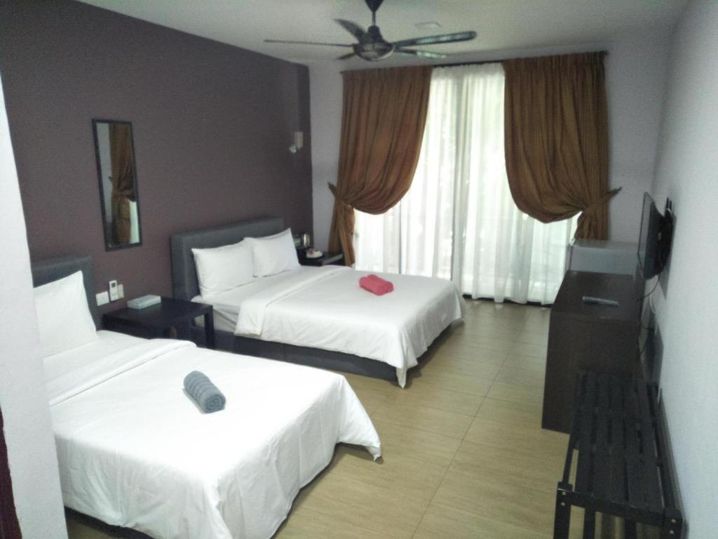 Ein Bett oder Betten in einem Zimmer der Unterkunft Red Coral Cottage