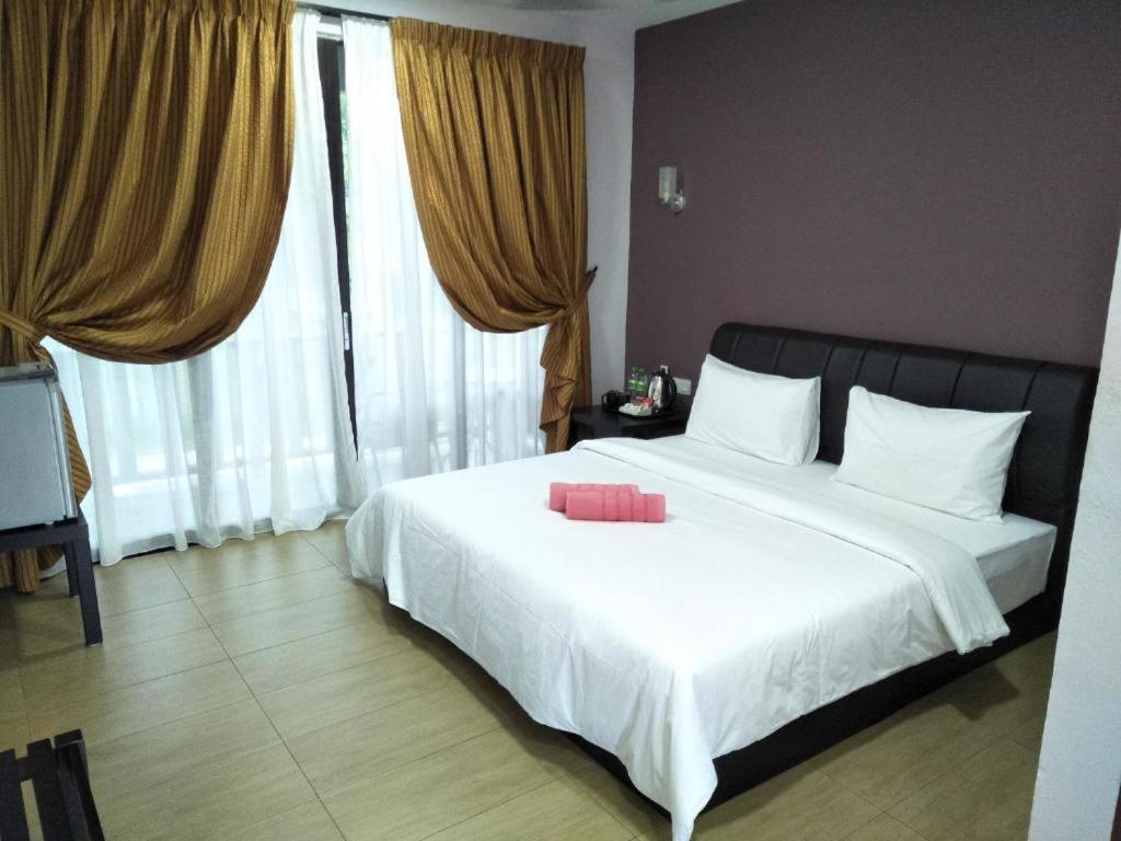 Ein Bett oder Betten in einem Zimmer der Unterkunft Red Coral Cottage