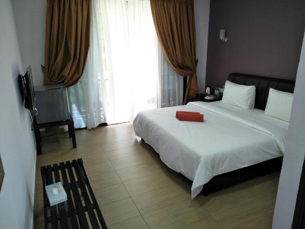 Ein Bett oder Betten in einem Zimmer der Unterkunft Red Coral Cottage