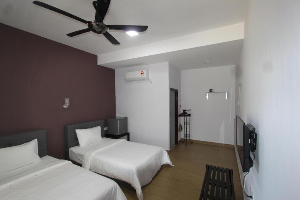 Ein Bett oder Betten in einem Zimmer der Unterkunft Red Coral Cottage