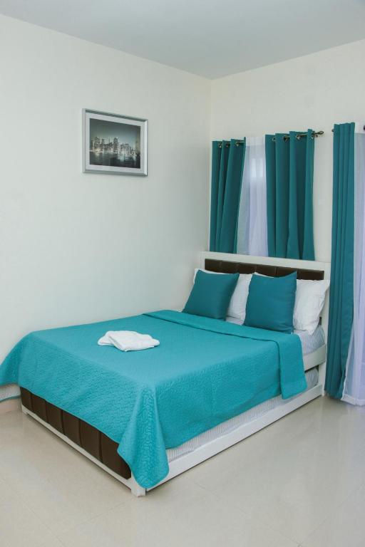 Postel nebo postele na pokoji v ubytování Amar Residence