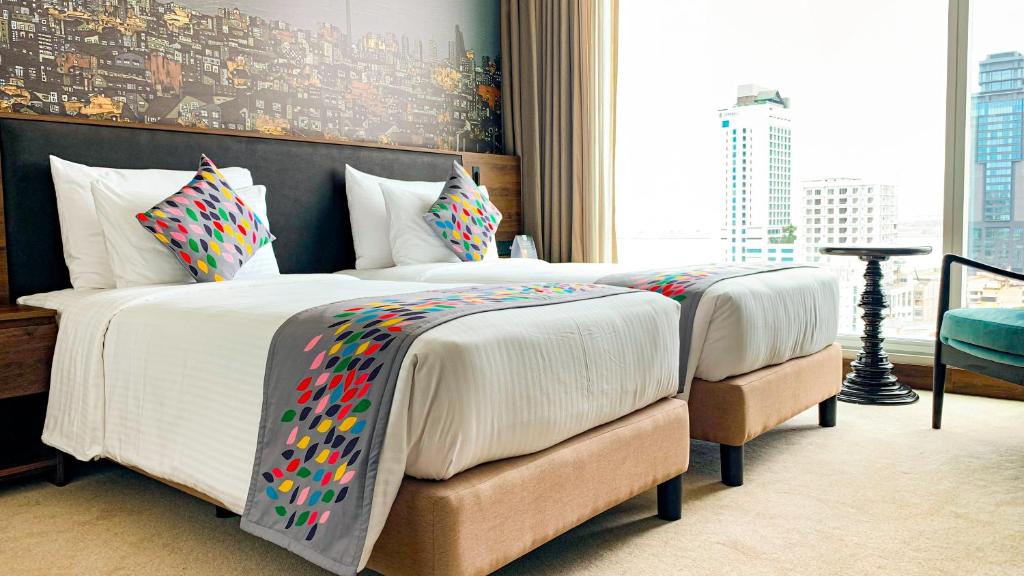 Postel nebo postele na pokoji v ubytování Sofia Colombo City Hotel