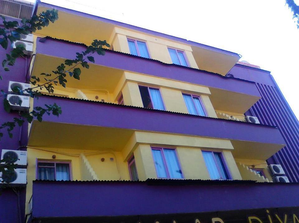 a purple building with windows on the side of it at Sunrise Hotel in Antalya