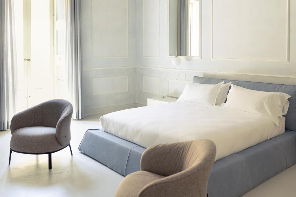 Postel nebo postele na pokoji v ubytování Palazzo Zimara Boutique Hotel