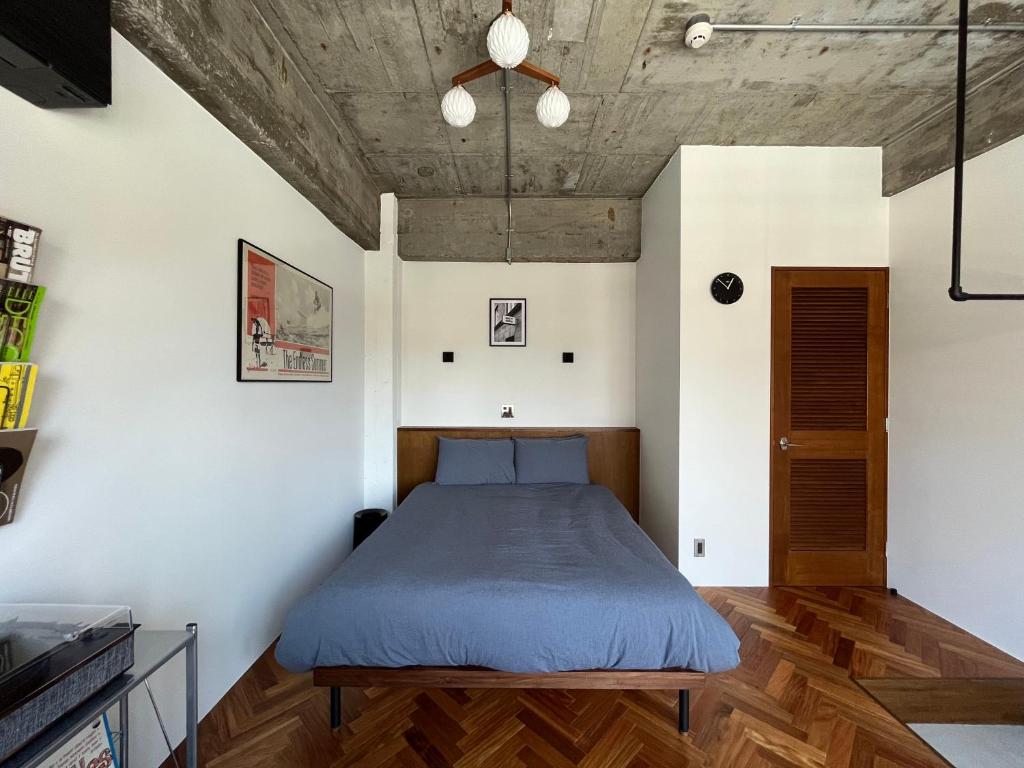 Postel nebo postele na pokoji v ubytování NO SERVICE HOTEL azumabashi