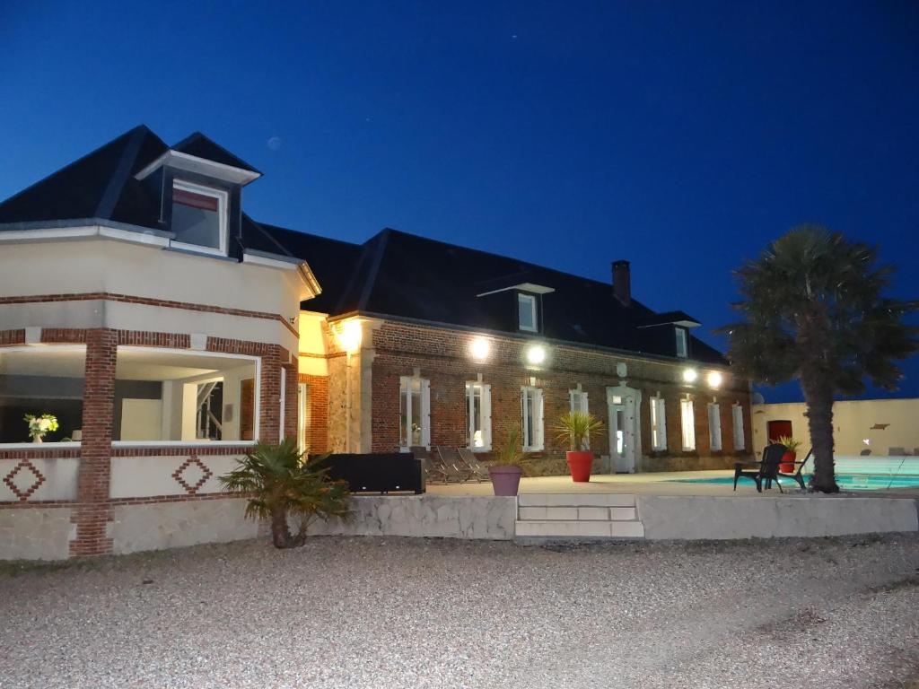 a house with lights on the front of it at Gîte pour 2 personnes le domaine de la roquette près de fécamp à ganzeville in Ganzeville