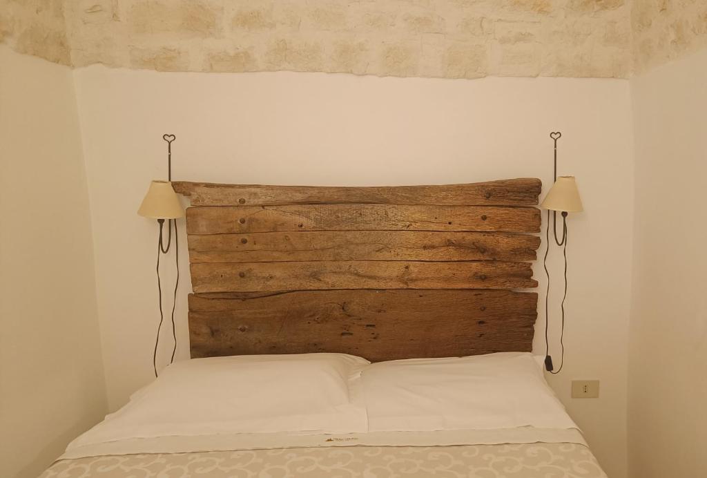 Postel nebo postele na pokoji v ubytování Trulli Soave