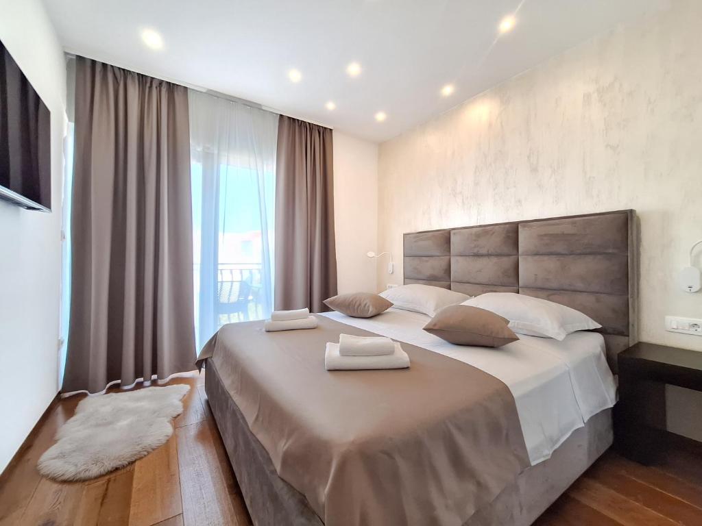 Ένα ή περισσότερα κρεβάτια σε δωμάτιο στο Kaša Rooms 2