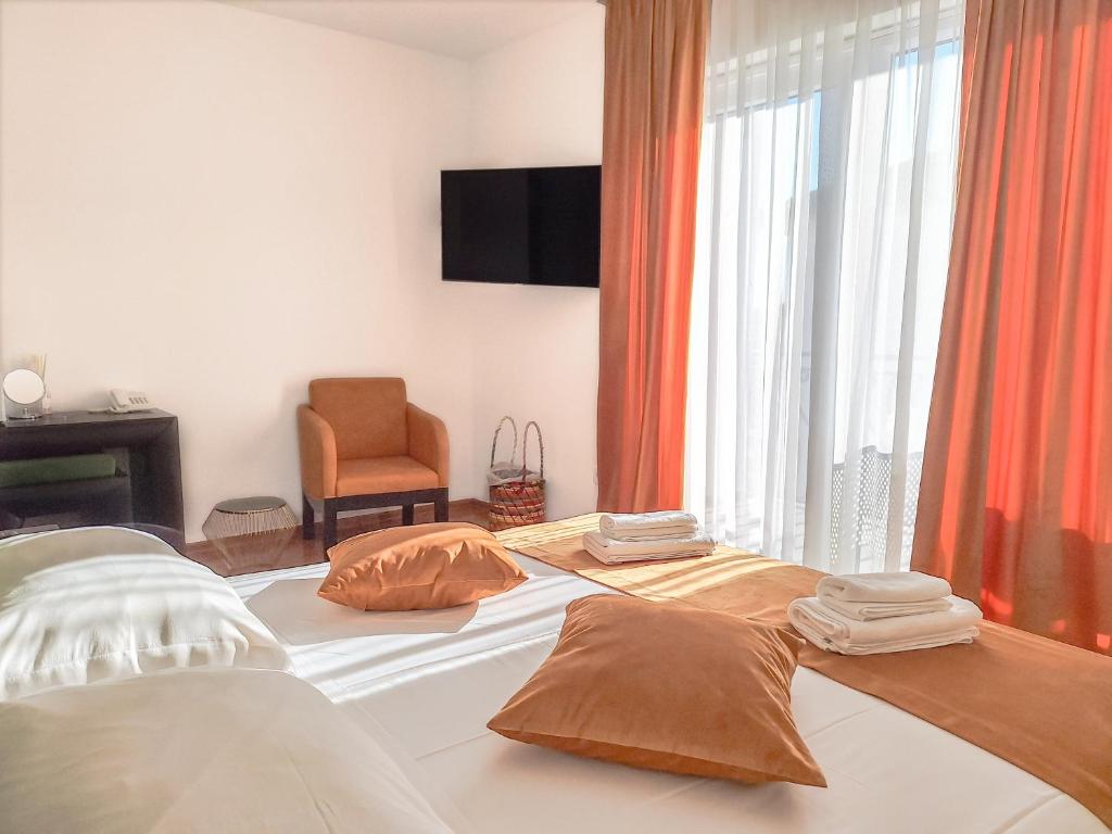 Ένα ή περισσότερα κρεβάτια σε δωμάτιο στο Kaša Rooms 2