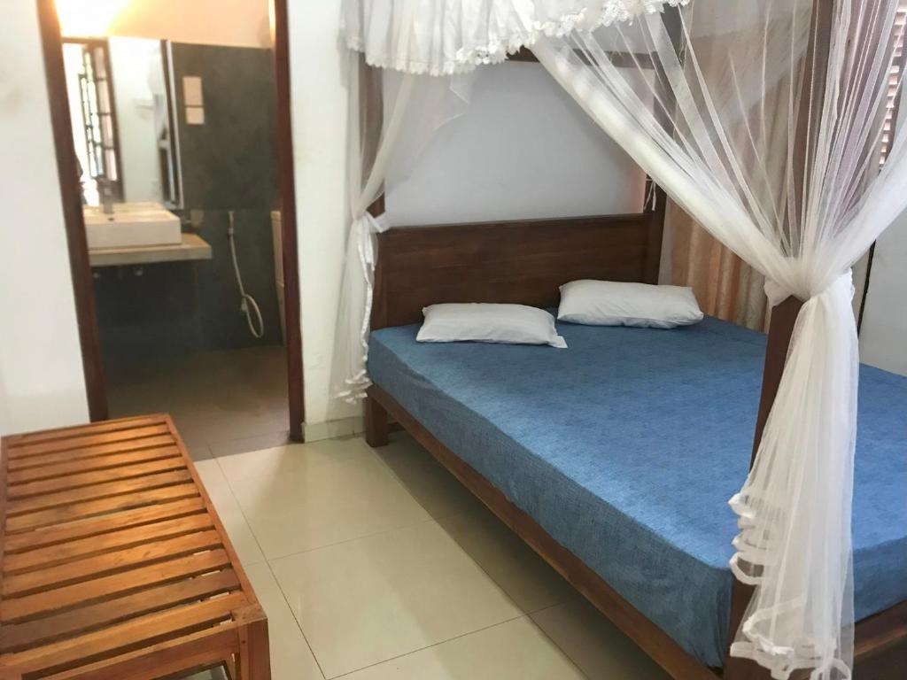 Postel nebo postele na pokoji v ubytování The Kandy Mount Layathraa