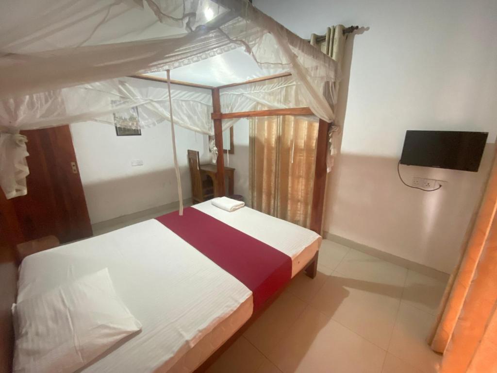 Postel nebo postele na pokoji v ubytování The Kandy Mount Layathraa