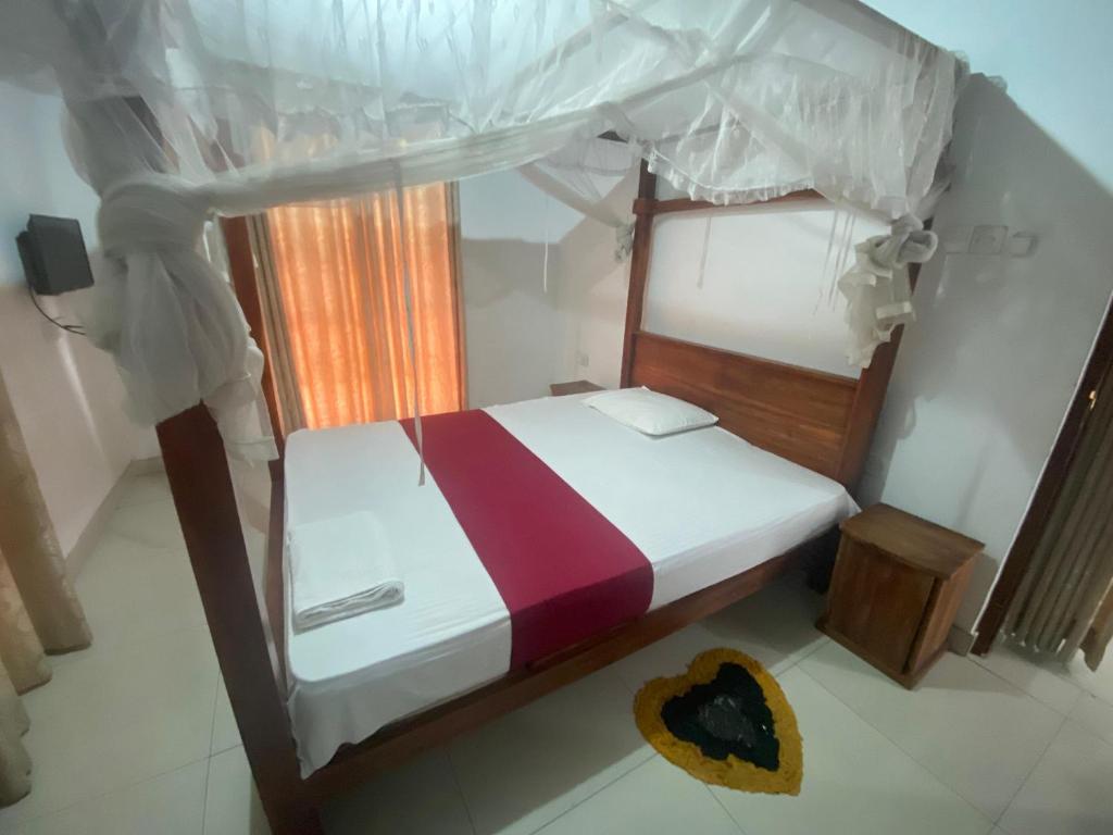 Postel nebo postele na pokoji v ubytování The Kandy Mount Layathraa