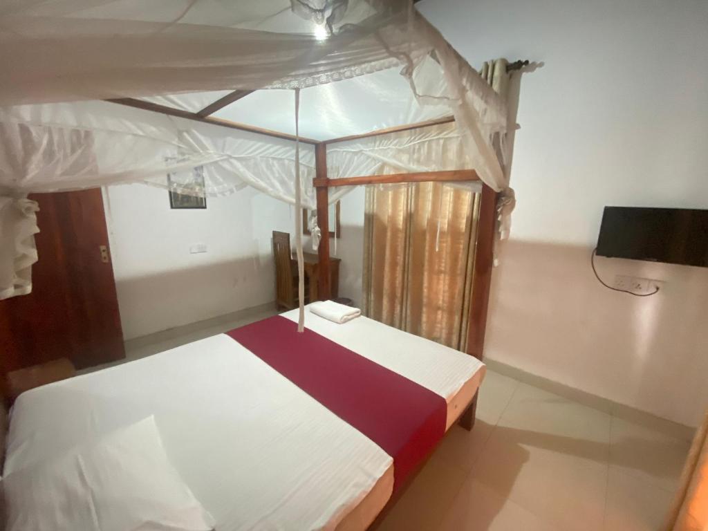 Postel nebo postele na pokoji v ubytování The Kandy Mount Layathraa