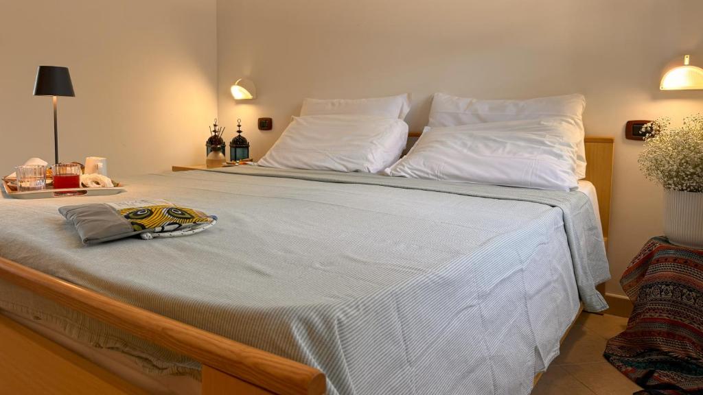 Postel nebo postele na pokoji v ubytování Villaggio Idra residence