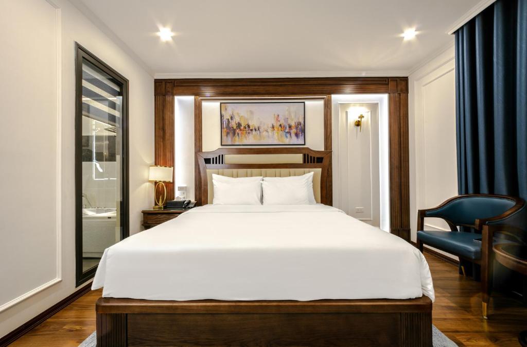 Postel nebo postele na pokoji v ubytování A25 Hotel - 16 Miếu Đầm
