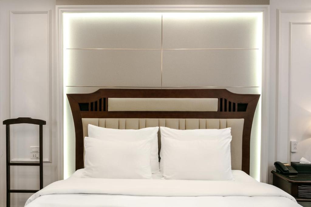 Postel nebo postele na pokoji v ubytování A25 Hotel - 16 Miếu Đầm