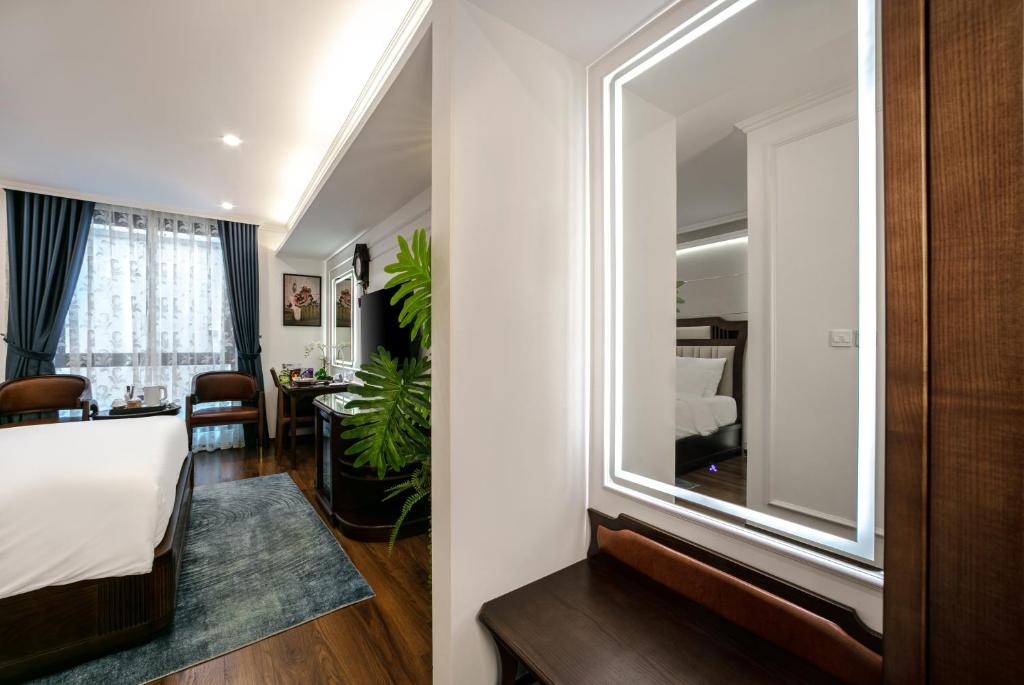 Postel nebo postele na pokoji v ubytování A25 Hotel - 16 Miếu Đầm