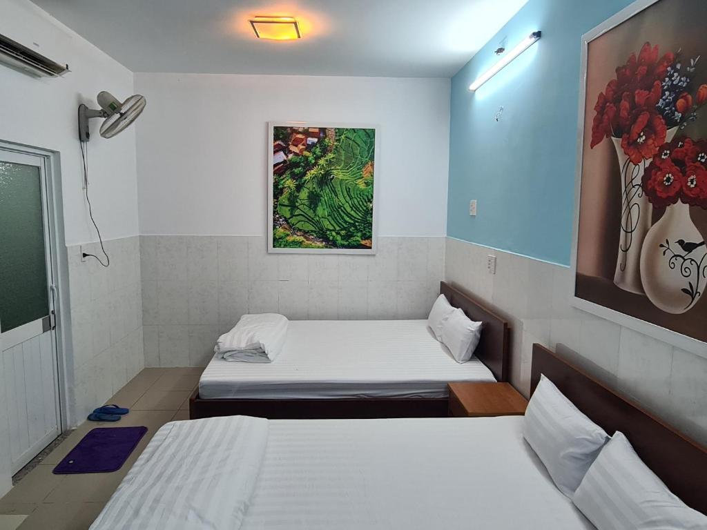 Postel nebo postele na pokoji v ubytování Bin Hom Motel