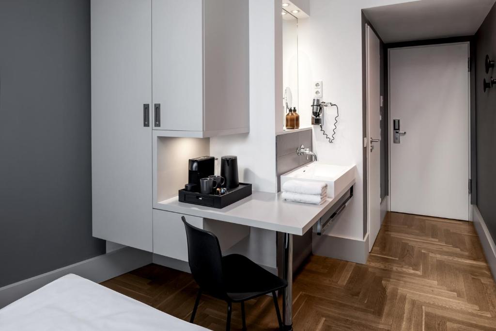 Kuchyň nebo kuchyňský kout v ubytování Hotel AMANO Rooms & Apartments