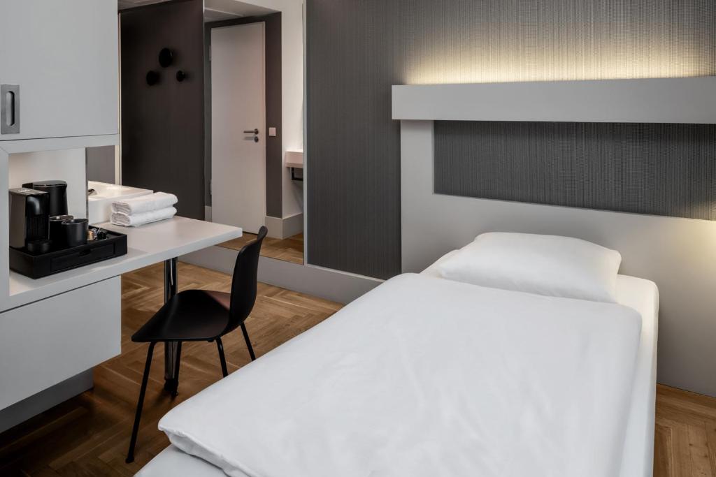 Postel nebo postele na pokoji v ubytování Hotel AMANO Rooms & Apartments