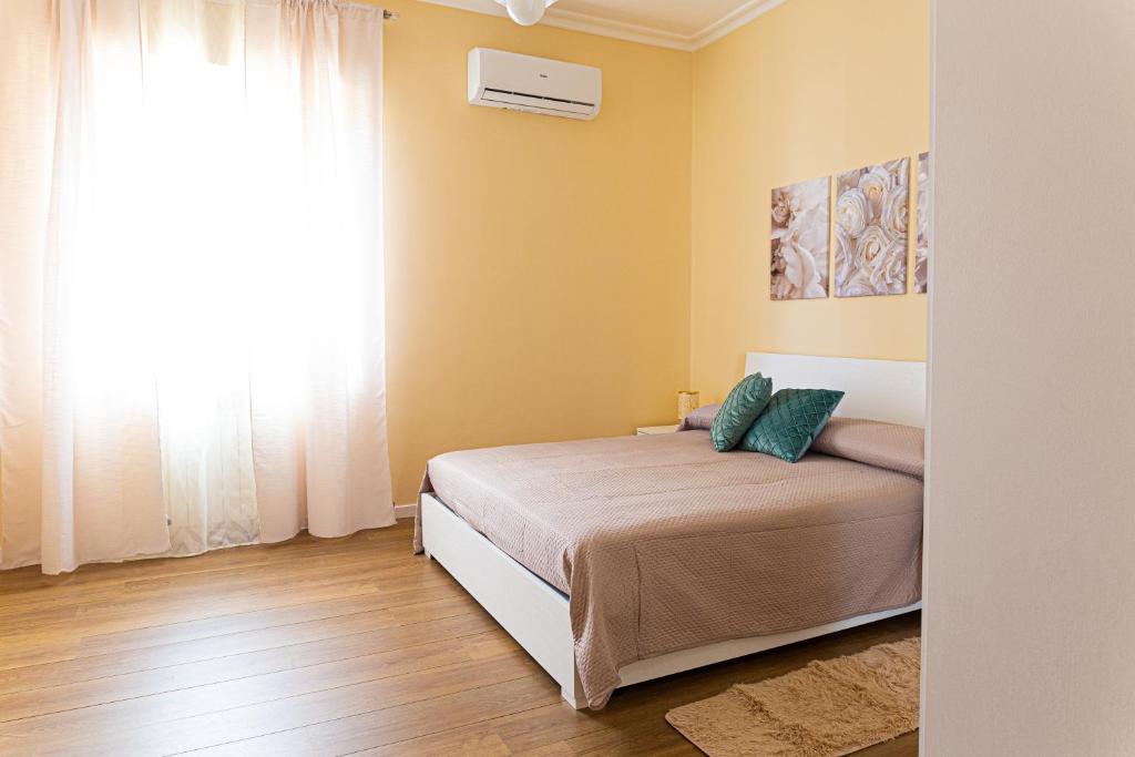 Ένα ή περισσότερα κρεβάτια σε δωμάτιο στο Alexas rooms Crotone