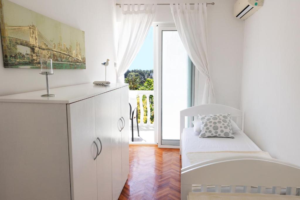 Postelja oz. postelje v sobi nastanitve Apartmani Novkovic