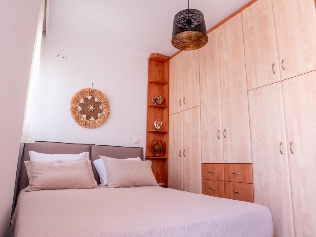 Postel nebo postele na pokoji v ubytování Athina's Home