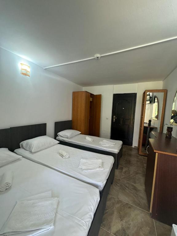 Postel nebo postele na pokoji v ubytování Hotel OBELISC