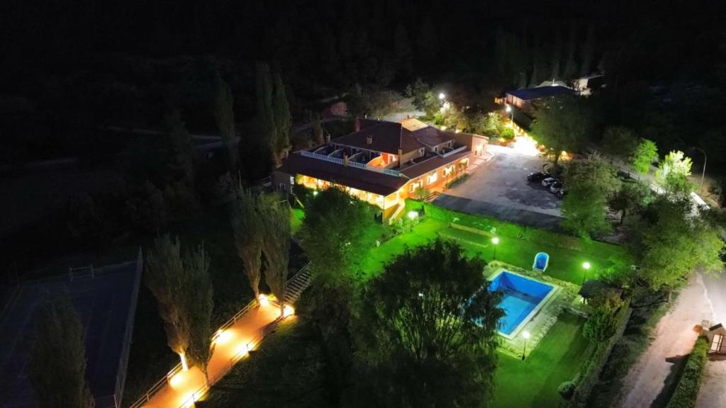 an overhead view of a house at night with lights at Hospedium Hotel Val de Pinares in Bogarra