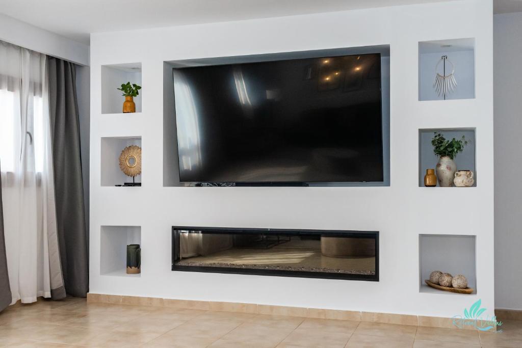 TV a/nebo společenská místnost v ubytování Casa Familia