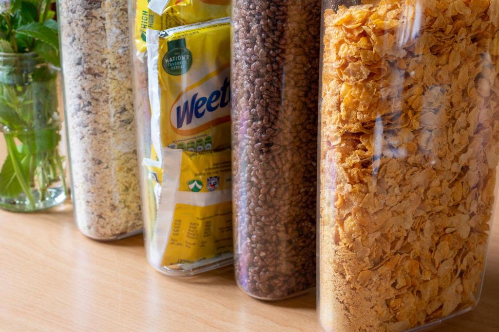 a group of four plastic containers of food on a table at Durness Youth Hostel in Durness