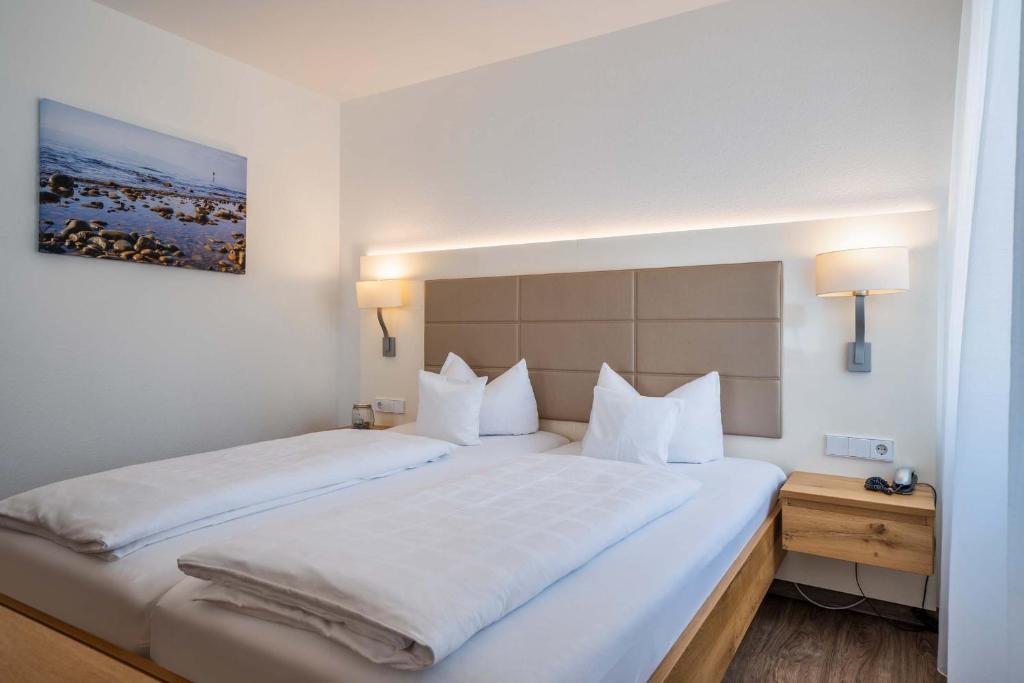 Postel nebo postele na pokoji v ubytování Hotel Lipprandt