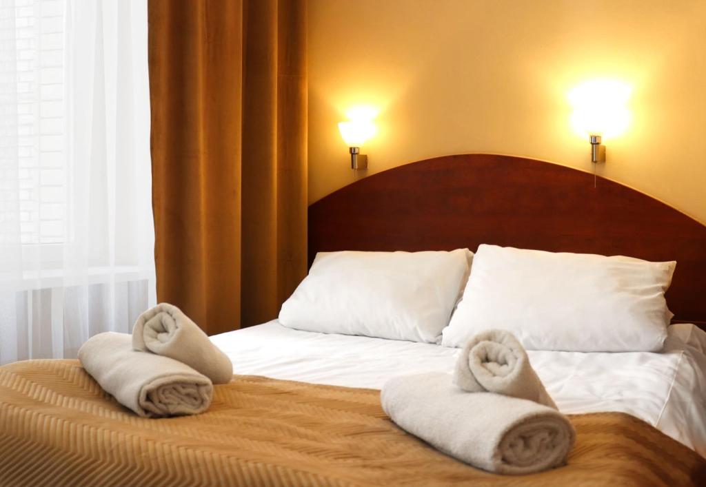 Posteľ alebo postele v izbe v ubytovaní Hotel Lothus