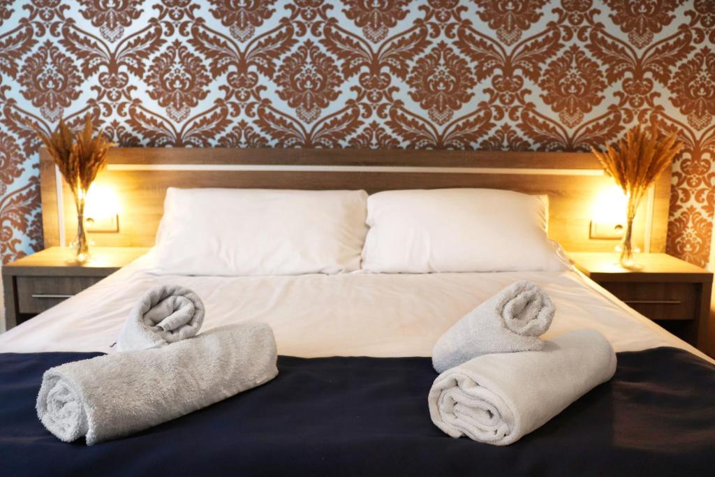 Posteľ alebo postele v izbe v ubytovaní Hotel Lothus