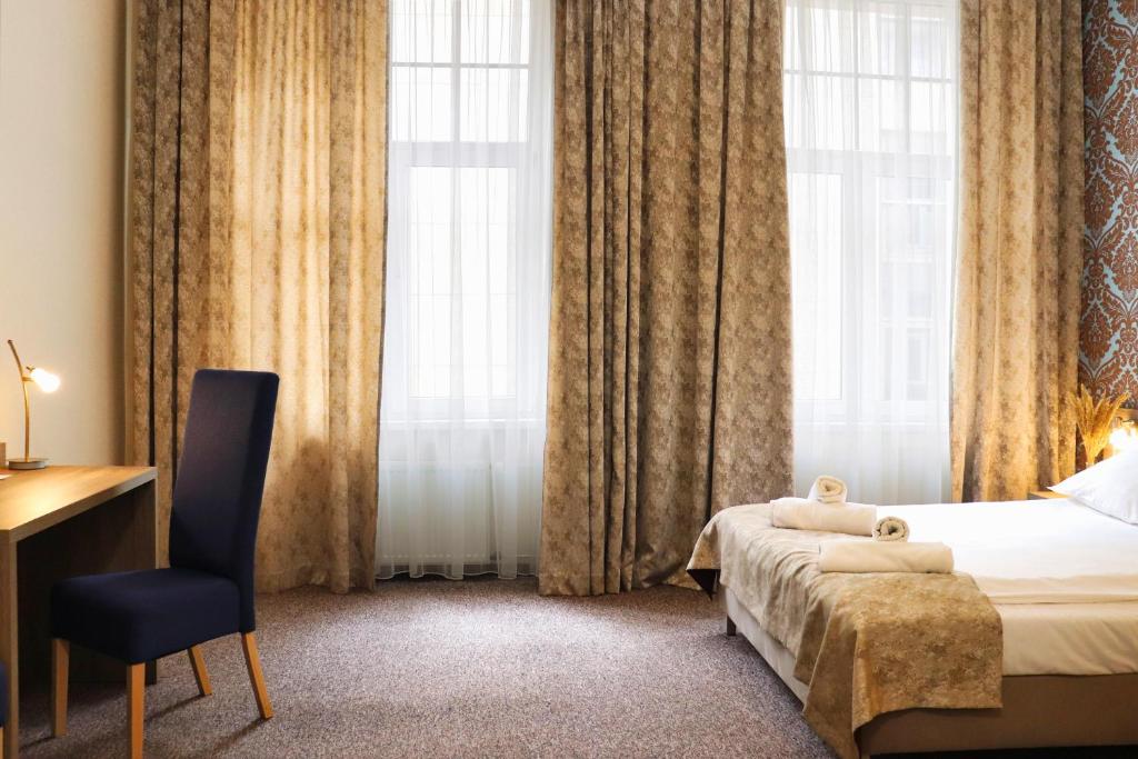 Posteľ alebo postele v izbe v ubytovaní Hotel Lothus